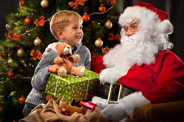 istock Santa Claus and a little boy 498531642