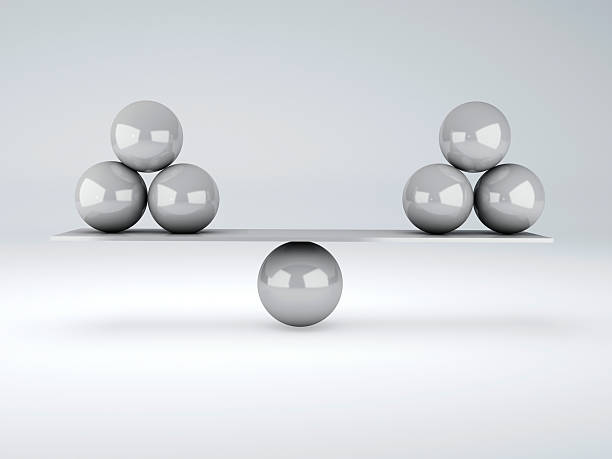 istock white spheres in equilibrium. Balance concept 498531967