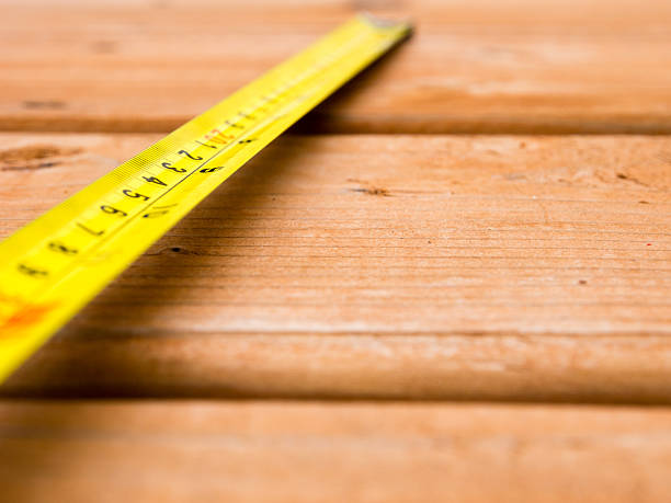 istock Tape measure on a wooden deck 498533014