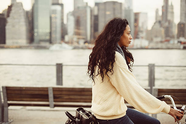 istock Hispanic woman commuting on Bicycle in NYC 498533750