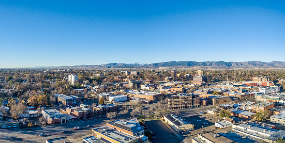 Fort Collins downtown aerial panorama,  fall  scenery od Colorado with Front Range of Rocky Mountains in background