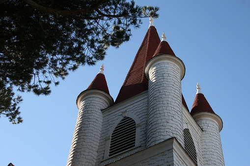 This church steeple is shaped like a castle with round towers. Located in Lompoc, CA.
