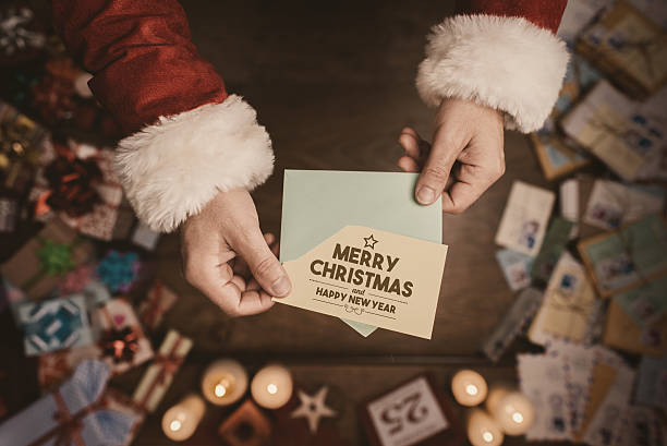 istock Santa Claus opening a Christmas letter 498537198