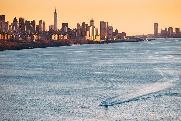 New York City Skyline over The Hudson River at Sunset.