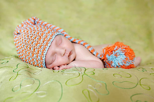 istock Caucasian newborn baby while sleeping closeup 498548298