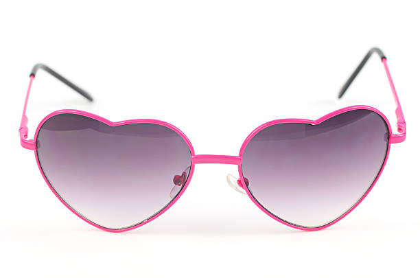 istock pink heart sunglasses on white background 498548836