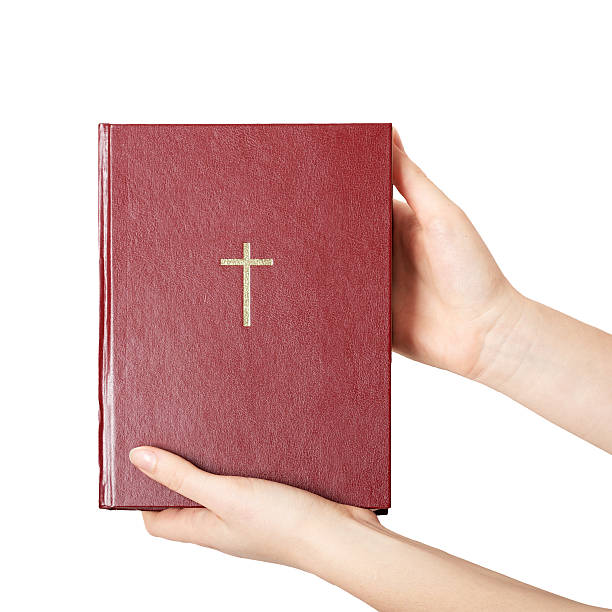 istock hands holding the book bible 498548884