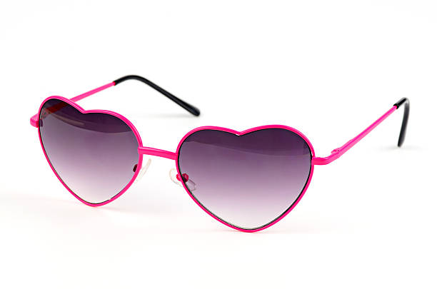 istock pink heart sunglasses on white background 498548902
