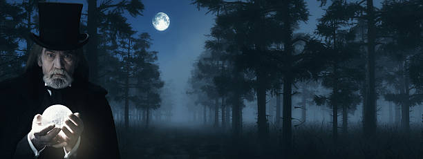 istock Illusionist Holding Illuminated Sphere in Foggy Winter Forest at Moonlight. 498549320