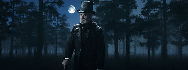 istock Dickens Scrooge Man with Cane in Misty Winter Forest. 498549372