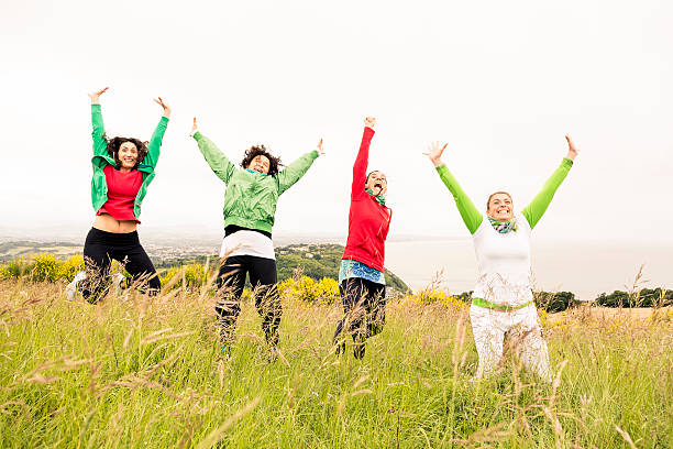 istock Happy women jumping 498549401