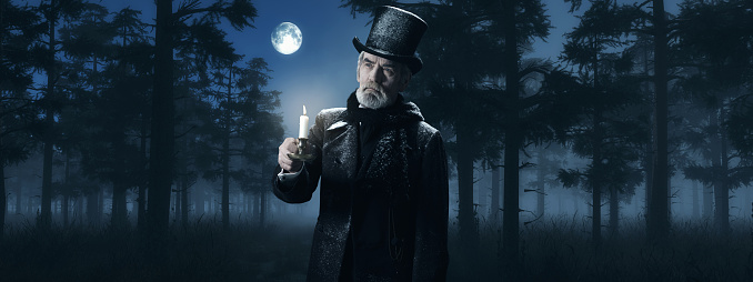 Dickens Scrooge Man with Candlestick in Foggy Winter Forest at Moonlight.