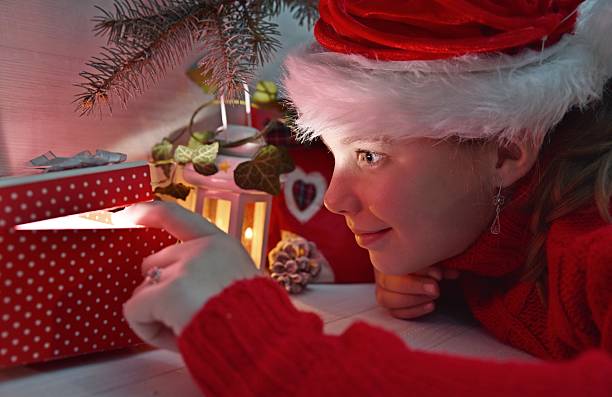 istock Girl under the Christmas tree 498549428