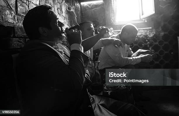 Three Businessmen Resting After A Hard Day At Work Stock Photo - Download Image Now