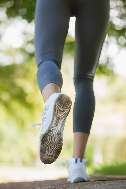 istock Jogger running along a pathway in the park 498551013