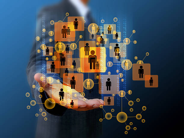 istock Businessman holding social network 498551573