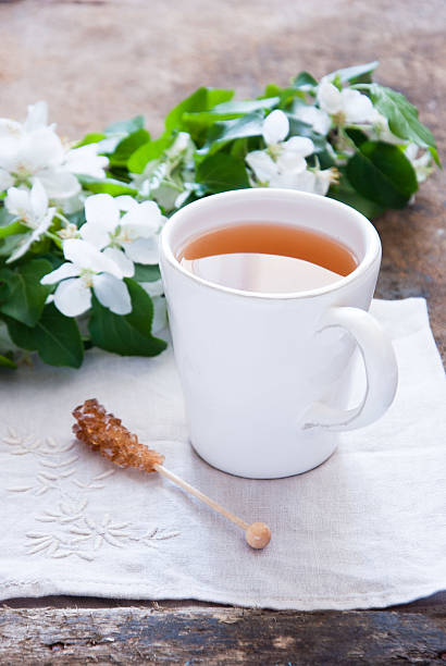 tasse grüner tee und blüte - jasmine tea black tea tea drink stock-fotos und bilder