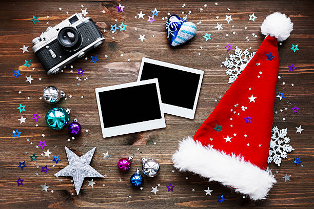 istock Christmas background with old camera, Santa's hat, photo frames, decorations 498552142