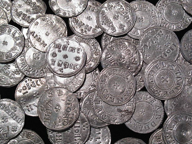 Viking And Anglo Saxon Silver Coin Hoard Hoard of Anglo Saxon and Viking silver penny coins found at The Vale of York, South Yorkshire, England, UK, dating from the 10th century anglo saxon photos stock pictures, royalty-free photos & images