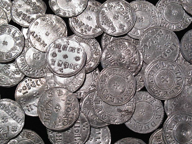 Viking And Anglo Saxon Silver Coin Hoard Hoard of Anglo Saxon and Viking silver penny coins found at The Vale of York, South Yorkshire, England, UK, dating from the 10th century money shortage stock pictures, royalty-free photos & images