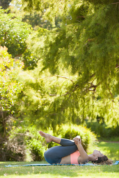 istock Fit woman doing pilates in the park 498553237