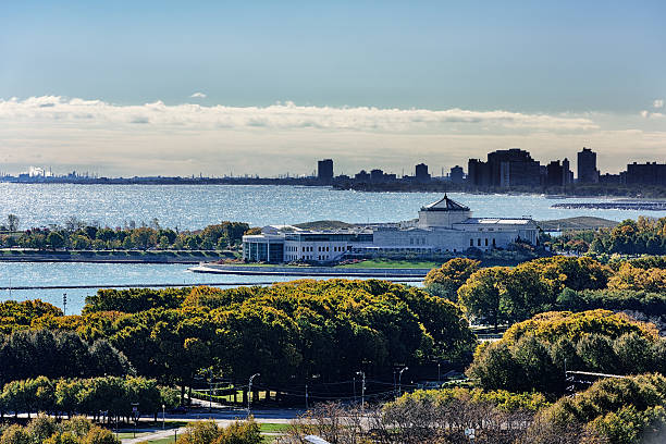 Shedd Aquarium  and Lake Michigan in Autumn, Chicago Chicago, USA - October 17, 2015: Shedd Aquarium on the Lake Michigan lakefront in the Museum Campus, Near South Side of Chicago. Autumn view from above with distant people. editorial architecture famous place local landmark stock pictures, royalty-free photos & images