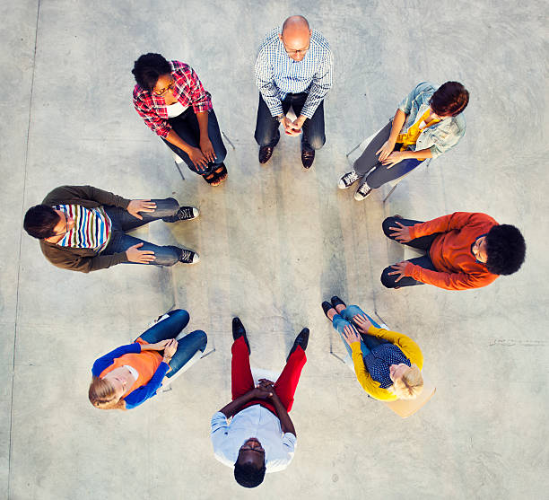 istock Multiethnic Group of People Sitting in Circle 498554539
