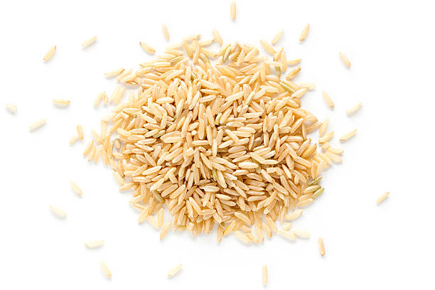 Brown rice Brown rice from above isolated on white background rice cereal plant stock pictures, royalty-free photos & images
