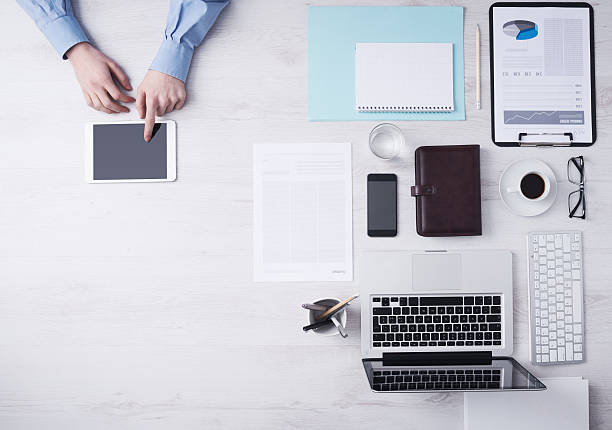 istock Businessman working at desk with a digital tablet 498556654