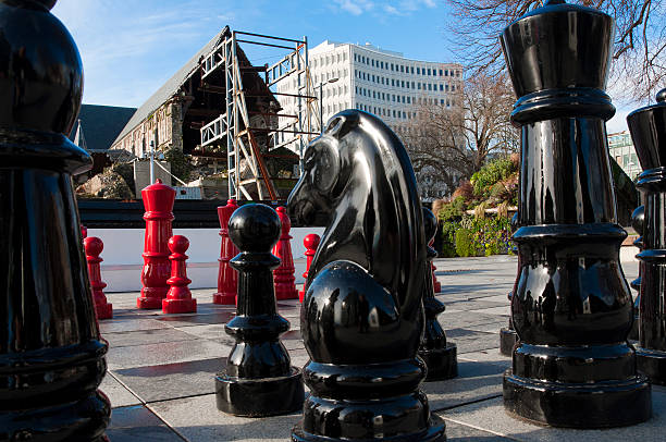 Schoolchildren playing giant chess at a science centre
