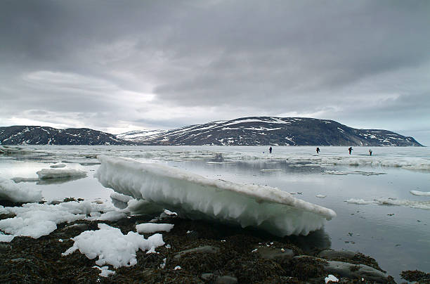 istock Fishing on ice at Wakeham Bay, Canada 498557118