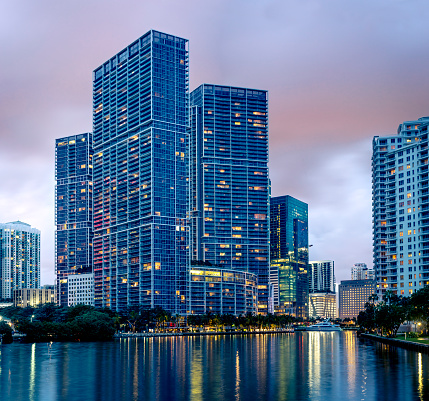 The Icon Brickell building, viewed from Brickell Key Dr over the channels water.