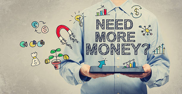 istock Need More Money concept with young man holding a tablet 498558078