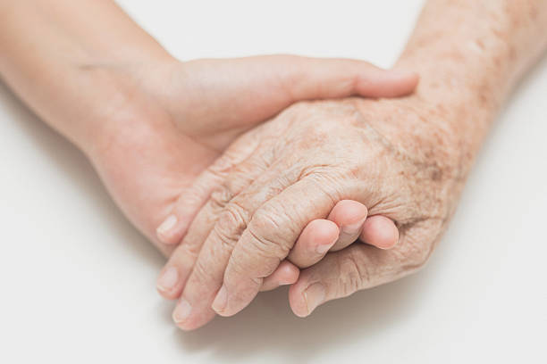 Help concept,The helping hands for elderly home care stock photo