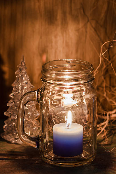 istock Blue candle in bottle glass 498559096