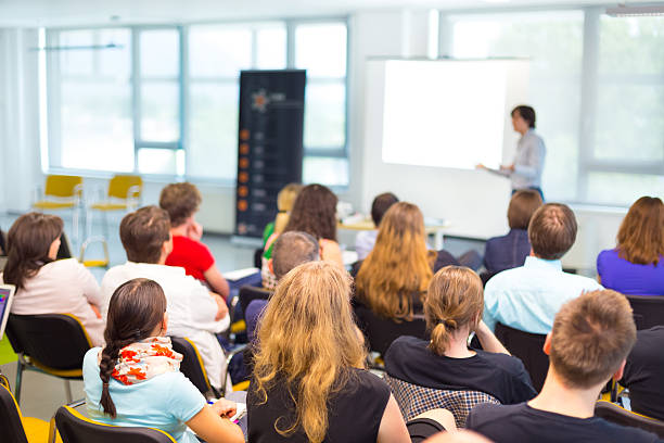 Speaker at Business convention and Presentation. Speaker at Business convention and Presentation. Audience at the conference hall. professor business classroom computer stock pictures, royalty-free photos & images