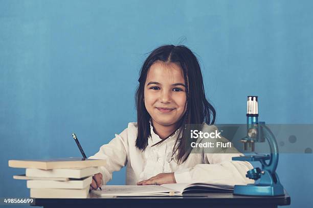 Schoolgirl In A Classroom Stock Photo - Download Image Now - 6-7 Years, 8-9 Years, Adult