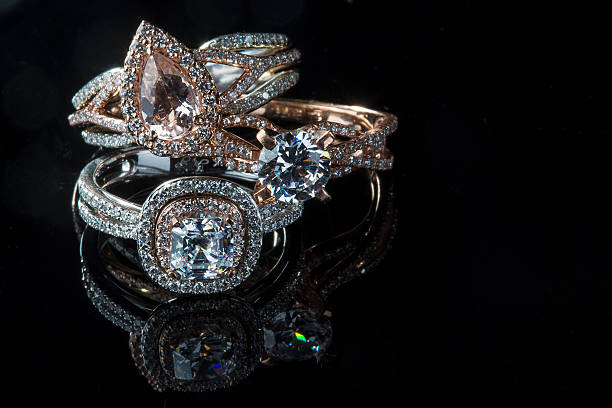 Diamond Rings Diamond Rings with black background diamond ring stock pictures, royalty-free photos & images