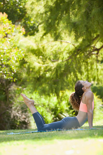 istock Fit woman stretching in cobra pose 498567253