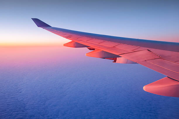 istock Airplane sunset sunrise sky view from a window 498567555