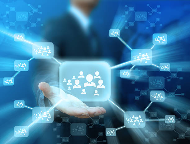 istock Businessman holding icon of social network 498567721