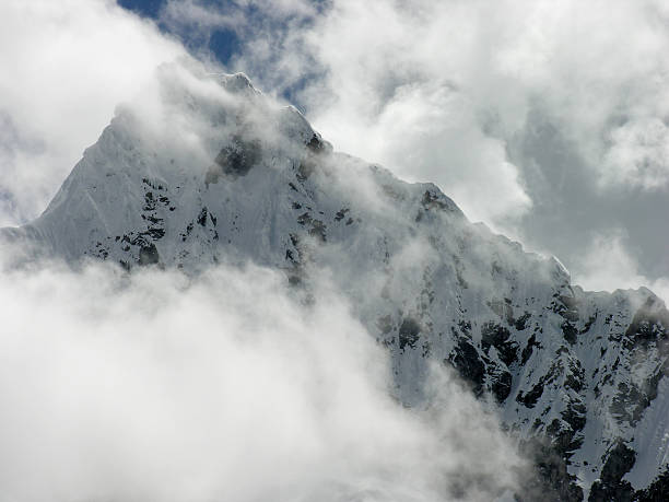 istock Snow capped mountain top in the clouds 498567957