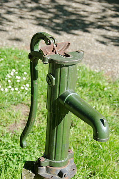 istock antique water pump tap in urban park 498568029