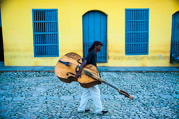 Cuban Musician Carrying Acoustic Bass stock photo