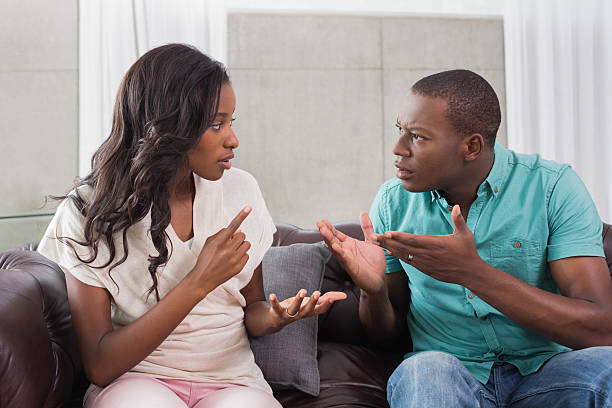istock Couple having a dispute on the sofa 498569749