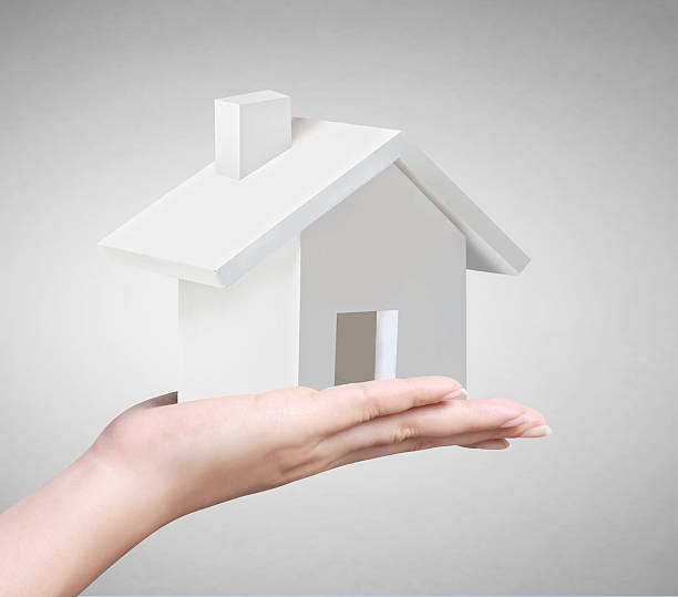 istock holding house representing home ownership 498570085