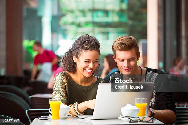 Urban Young People In Coffee Shop Stock Photo - Download Image Now - Coffee Shop, Couple - Relationship, Working