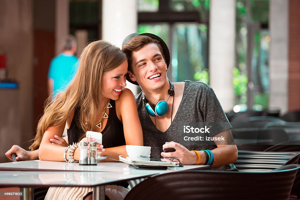 Young couple in cafe Cheerful young couple dating in coffee shop. 20-24 Years Stock Photo