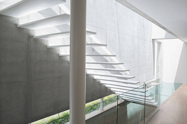 istock Stylish modern home interior with staircase 498572319