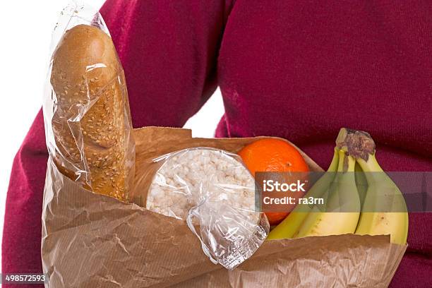 Woman Carrying Bag Of Groceries Stock Photo - Download Image Now - Adult, Bag, Banana